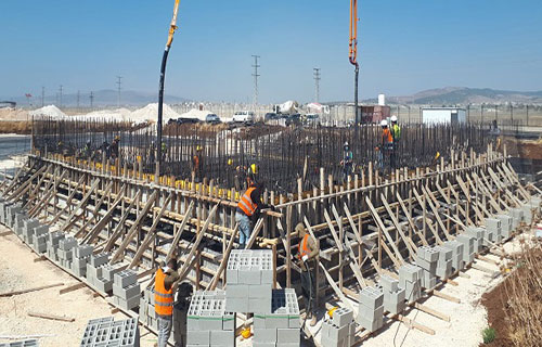 المواد الأولية وأجرة المعدات تهبط بتكاليف البناء بالضفة في أيار